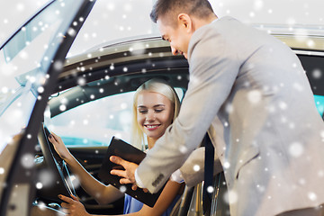 Image showing happy woman with car dealer in auto show or salon