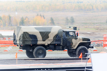 Image showing Curtain sided truck comes through on high obstacle