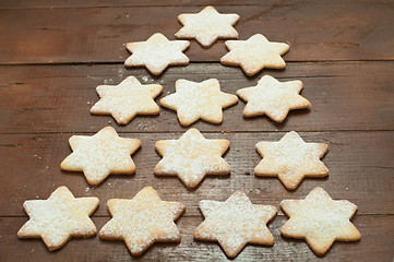 Image showing Christmas cookies in the shape of star with flour and butter