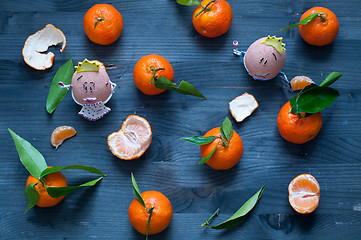 Image showing Mandarin orange fruit typical of winter with 2 nice eggs