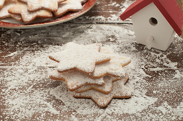 Image showing Christmas cookies in the shape of star with flour and butter