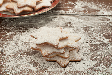 Image showing Christmas cookies in the shape of star with flour and butter