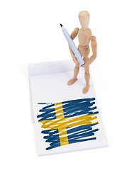 Image showing Wooden mannequin made a drawing - Sweden