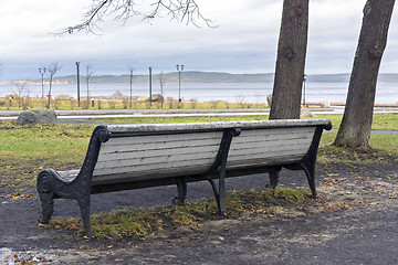 Image showing City bench in park in autumn