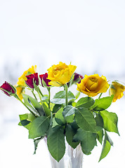 Image showing Bouquet of yellow and red roses in vase