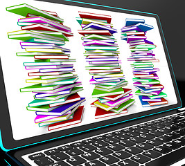 Image showing Pile Of Books On Laptop Showing Studying