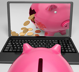 Image showing Coins Piggy Laptop Shows Banking Financial Success