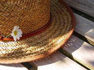 Image showing straw hat on bench