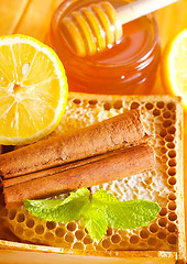 Image showing honey with cinnamon and lemon