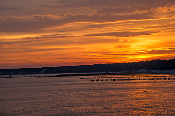 Image showing Sunrise over the Baltic Sea with groynes