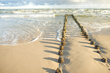 Image showing Baltic Sea with groynes and surf