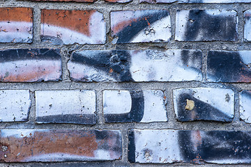 Image showing  old brick wall with graffitti