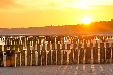 Image showing Sunrise over the Baltic Sea with groynes