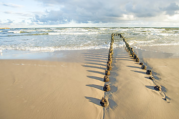 Image showing Baltic Sea with groynes and surf
