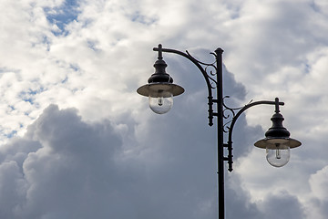 Image showing Street lantern with dark cloudy sky