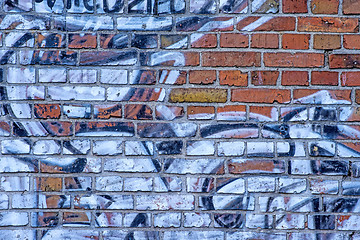 Image showing  old brick wall with graffitti