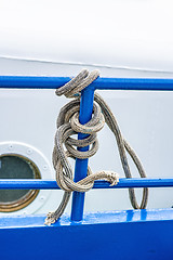 Image showing rope on a blue reling of a trawler