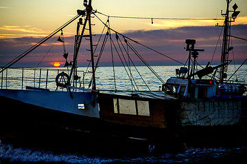 Image showing sunset over the Baltic Sea with trawler