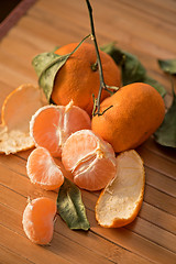 Image showing  tangerines on wooden background
