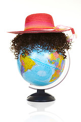 Image showing The terrestrial globe and curly wig