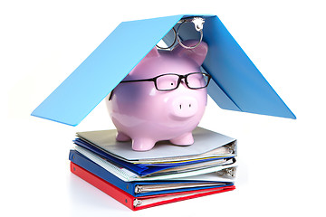 Image showing Pink piggy bank and documents