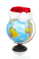 Image showing The terrestrial globe and fur-cap