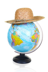 Image showing The terrestrial globe and straw hat