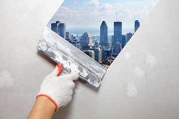 Image showing Contractor Plasterer.  City and skyscraper