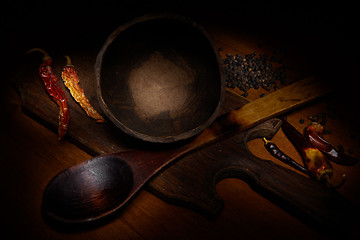 Image showing Red pepper and wooden crockery