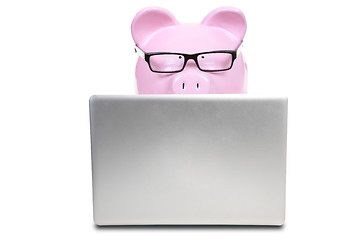 Image showing The pink pig and notebook computer