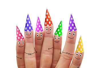Image showing Happy fingers in multicolored caps on a white background