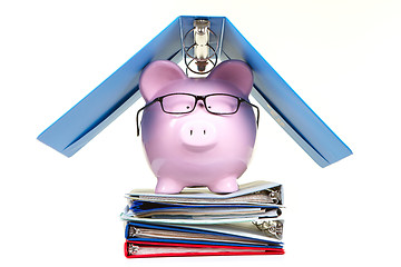 Image showing Pink piggy bank and documents