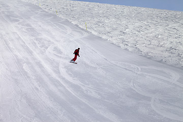 Image showing Ski slope and snowboarder at cold day