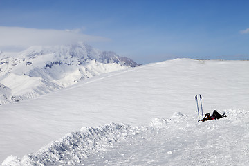 Image showing Skiing and snowboarding equipment on slope at sunny day