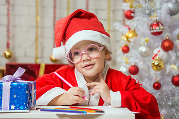 Image showing Girl wondering drawing card for Christmas