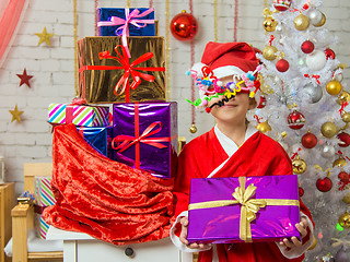 Image showing Girl with fireworks rolling in from the eyes rejoices bestowed gifts