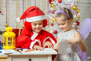 Image showing Santa Claus and fairy helper packaged in envelopes greeting letter