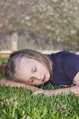 Image showing girl sleeping on the grass