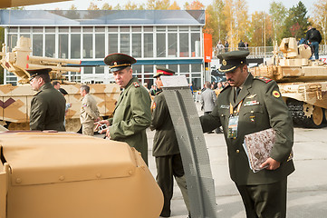 Image showing Officers of foreign army studies tank T-72. Russia