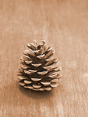 Image showing Pine cone on a wooden table