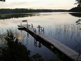 Image showing Young girl on docking bridge