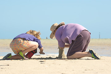 Image showing kids building sandcastles series no 1