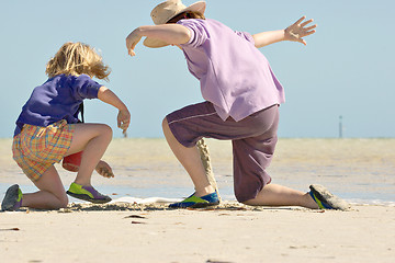 Image showing kids building sandcastles series no 1