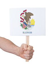 Image showing Hand holding small card - Flag of Illinois