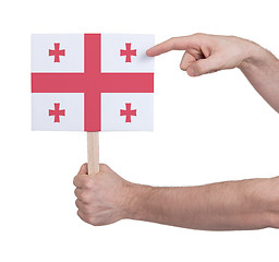 Image showing Hand holding small card - Flag of Georgia