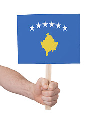 Image showing Hand holding small card - Flag of Kosovo