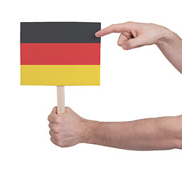 Image showing Hand holding small card - Flag of Germany