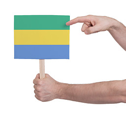 Image showing Hand holding small card - Flag of Gabon