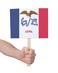 Image showing Hand holding small card - Flag of Iowa