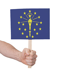 Image showing Hand holding small card - Flag of Indiana